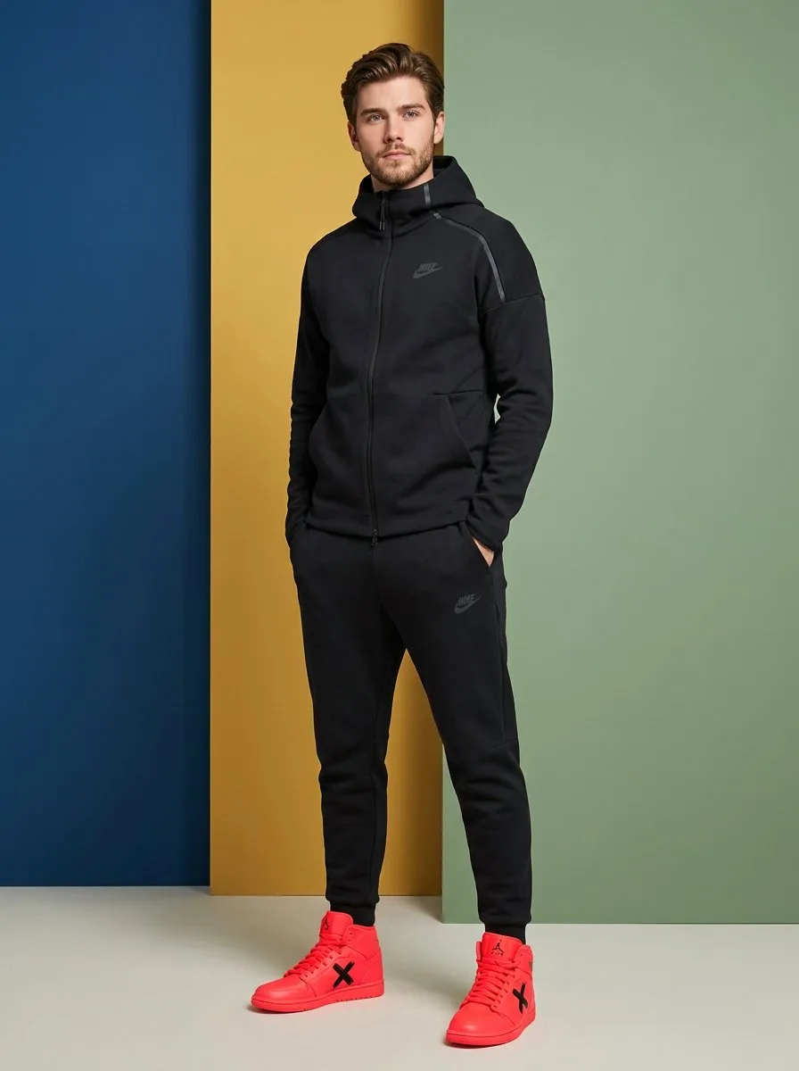 ผู้ชายในชุด Nike สีดำด้านและรองเท้าจอร์แดนสีนีออน 1